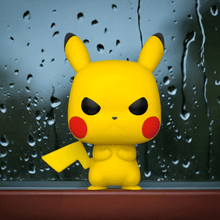 Load image into Gallery viewer, Grumpy Pikachu Pokemon POP! Vinyl Figure, standing with a fierce expression, vibrant yellow color, and clenched fists against a rainy backdrop.
