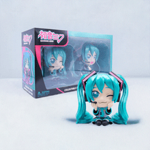 Load image into Gallery viewer, Hatsune Miku Collectible Twin Figure Pack showcasing two figures with signature twin-tail design, in front of a themed box.
