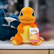 Load image into Gallery viewer, Pokemon 8 Inch Plush - Charmander Sitting on display with tag, soft and huggable toy for collectors and fans.
