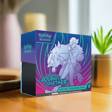 Load image into Gallery viewer, Pokemon TCG Journey Together Elite Trainer Box with vibrant packaging on a table.
