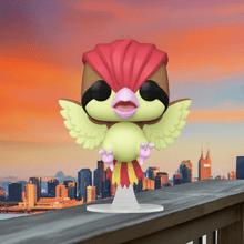 Load image into Gallery viewer, Pidgeotto Pokemon POP! Vinyl Figure on display with stylized design and vibrant colors, set against a cityscape backdrop.
