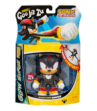 Load image into Gallery viewer, Goo Jit Zu Sonic Glow Surge Shadow figure in packaging, featuring glow-in-the-dark stretchy toy.
