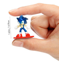 Load image into Gallery viewer, Sonic The Hedgehog die-cast metal mini figure held between fingers, 1.65 inches tall.
